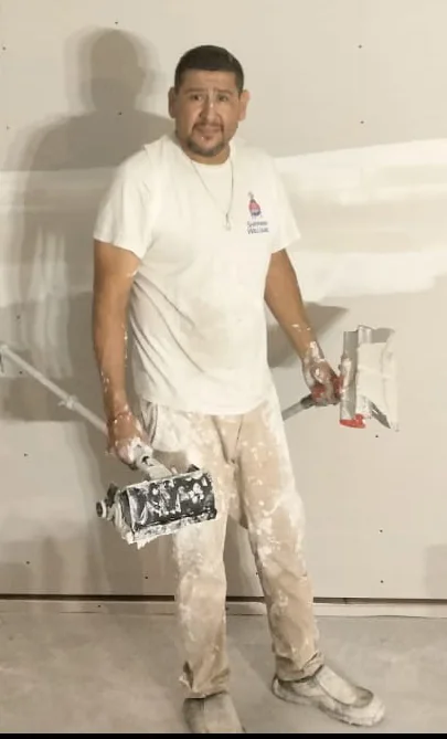 Gerardo, owner of G&M Drywall Patch, on the job